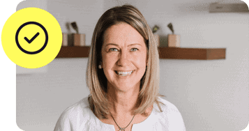 woman smiling at camera with checkbox icon