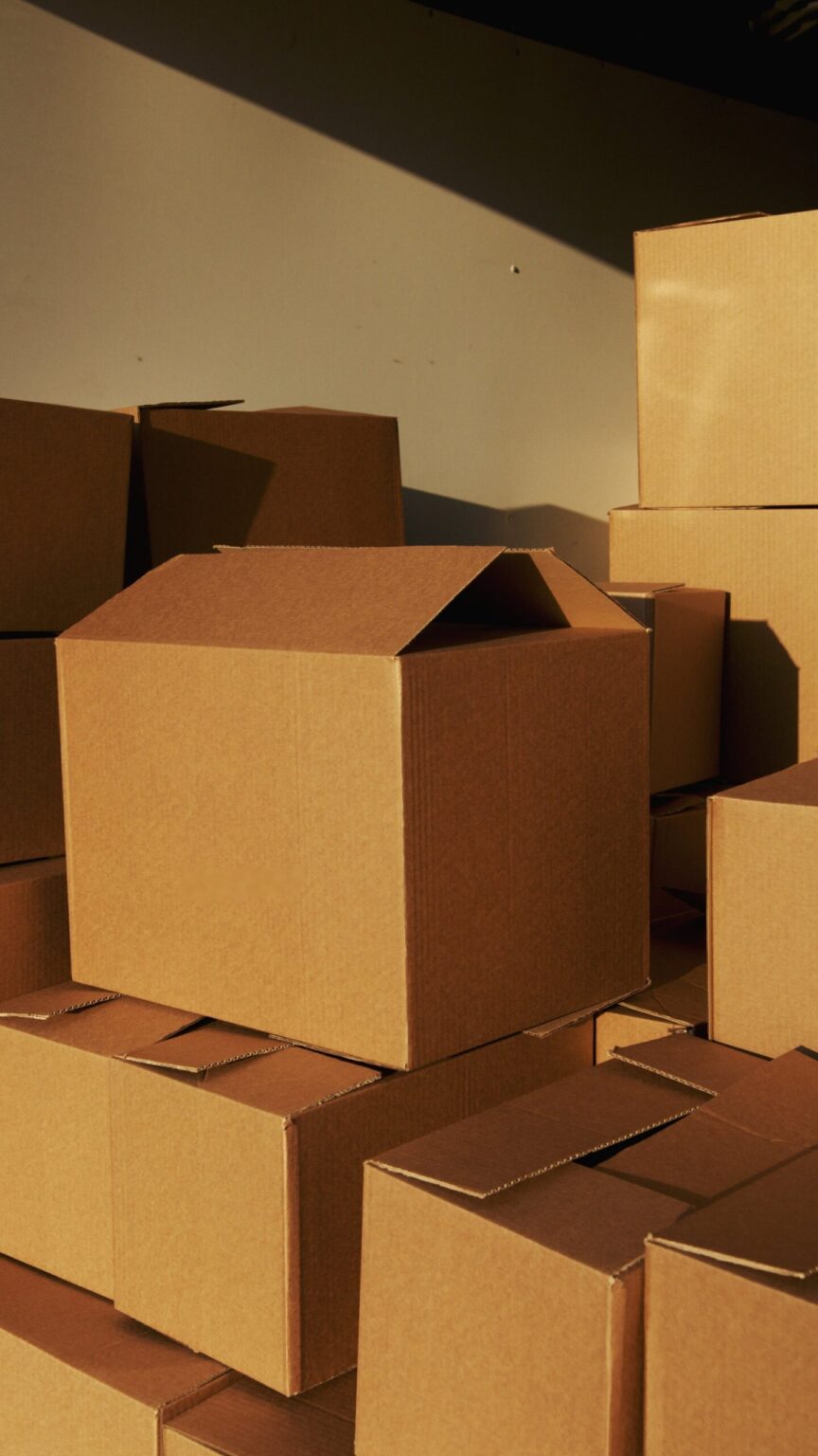 piles of Amazon cardboard boxes piled up in stacks