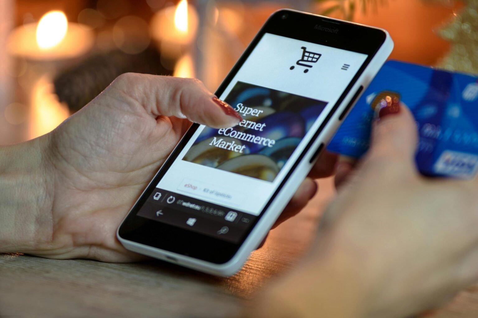 hand holding phone that has an eCommerce advertisement on it, thumb about to scroll